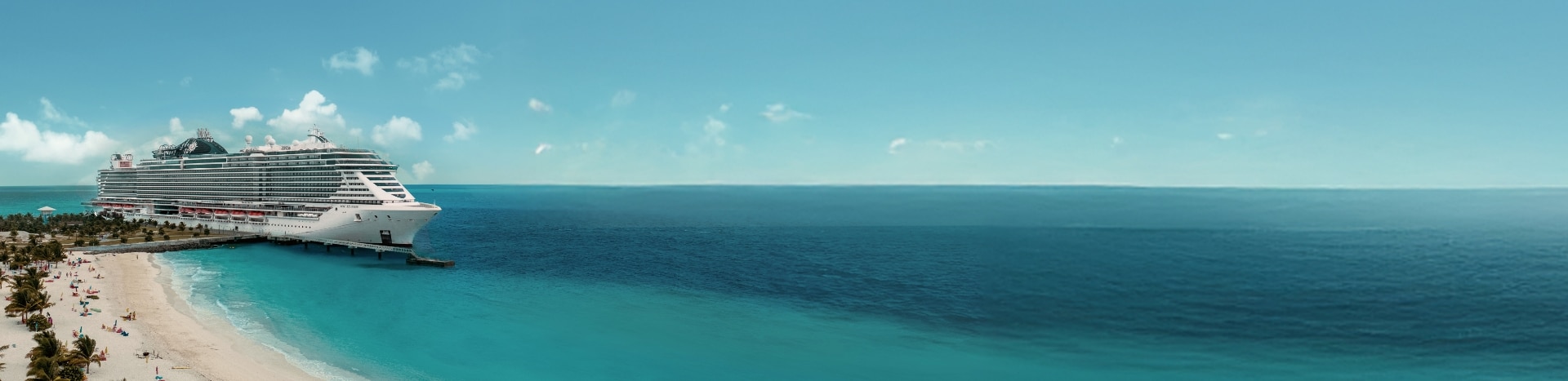 MSC cruise ship sailing across calm blue waters at sunrise, showcasing modern design and open decks.