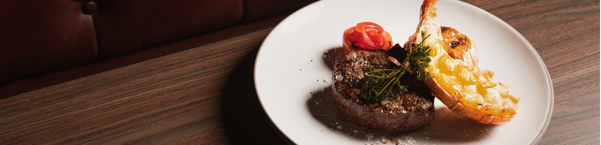 A plate of lobster and filet mignon served on board an MSC Cruise.