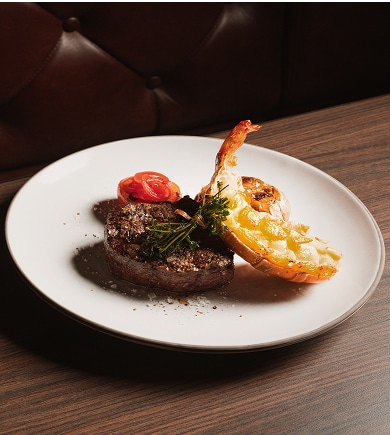 A plate of lobster and filet mignon served on board an MSC Cruise.