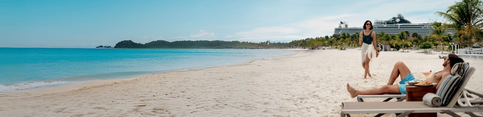 A couple having drinks by the beach on their MSC Cruises Ship
