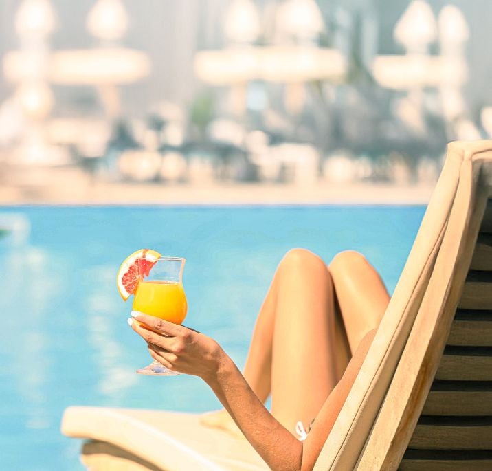 A person relaxing while having a drink on an MSC Cruise | MSC Cruises