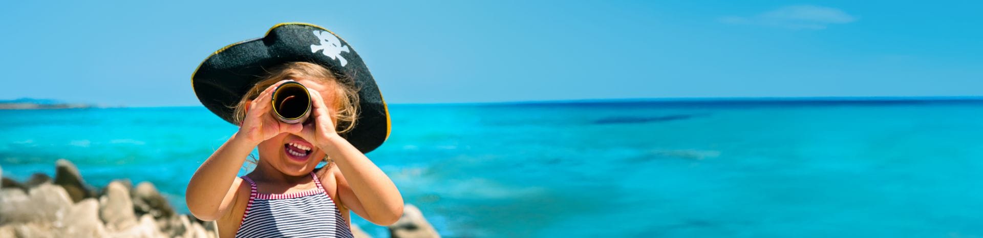 A little girl dressed as a pirate sailing on an MSC cruise ship.