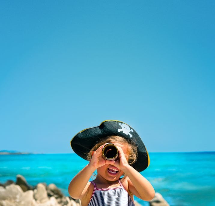A little girl dressed as a pirate sailing on an MSC cruise ship.