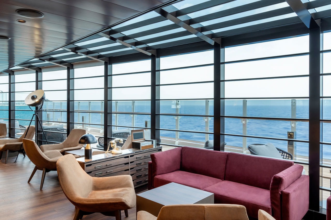 Modern café with expansive windows and sea views on MSC Seashore | MSC Cruises