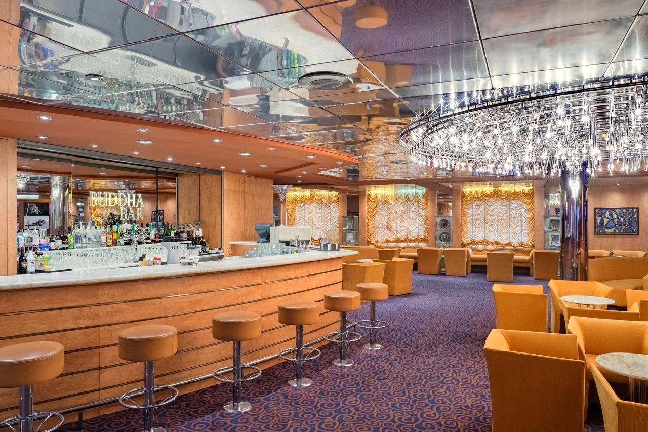 Inviting bar area with comfortable seating and a warm ambiance for relaxation | MSC Cruises