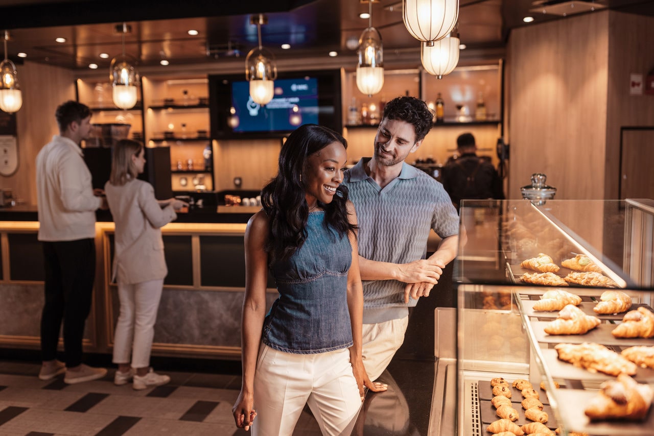 Guests select from a variety of pastries in a welcoming onboard setting | MSC Cruises