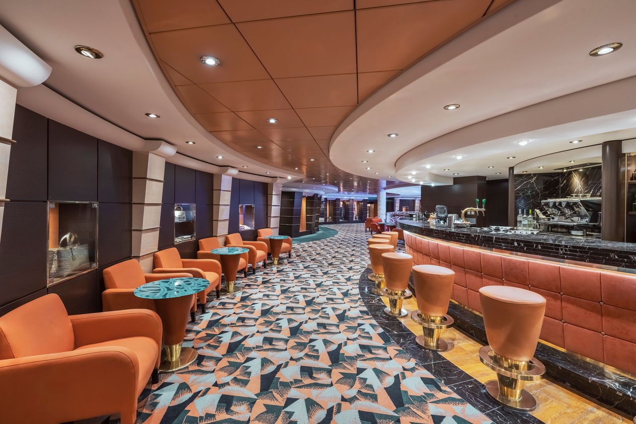 Inviting space featuring comfortable seating and a stylish bar area aboard MSC Musica | MSC Cruises