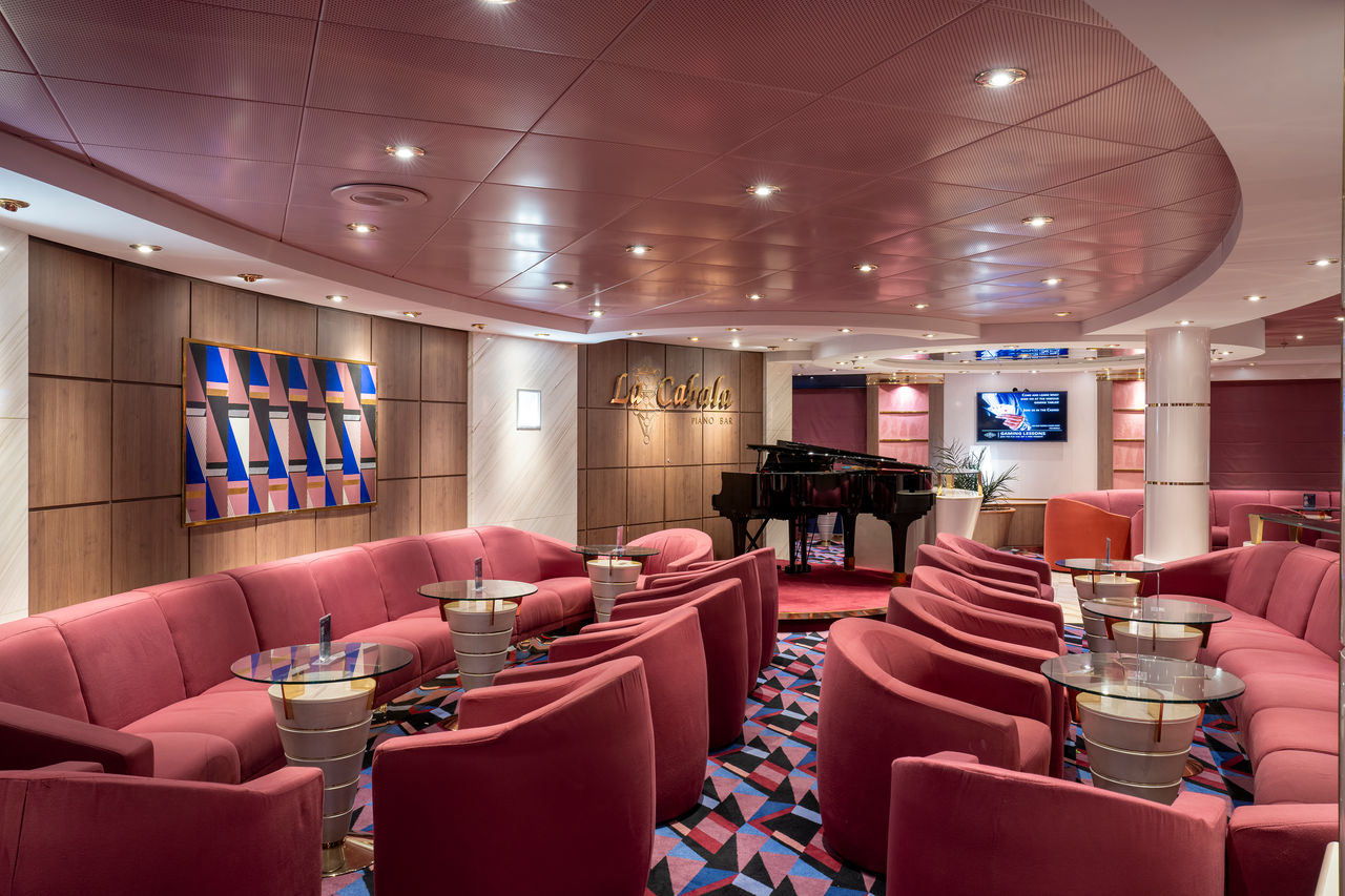 Piano bar with comfortable seating and a welcoming ambiance aboard MSC Opera | MSC Cruises