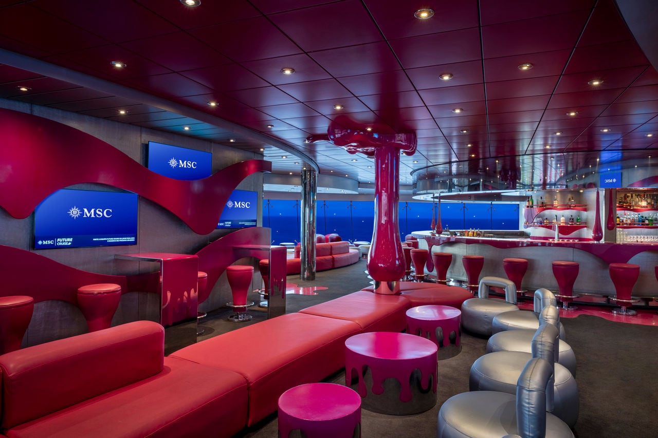 Liquid Disco Bar features vibrant seating areas and sea views aboard MSC Fantasia | MSC Cruises