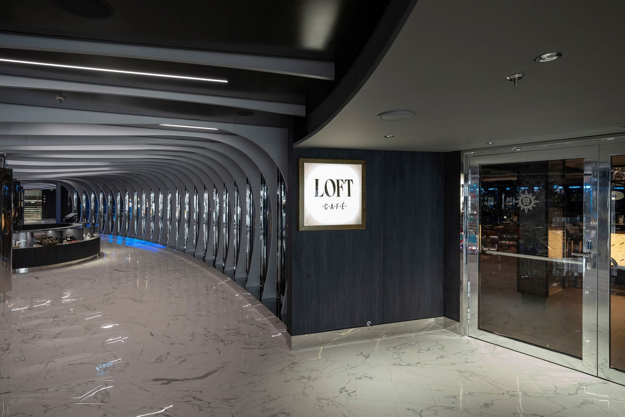 The entrance to Loft Cafè on MSC Seascape with a contemporary corridor and inviting ambiance | MSC Cruises