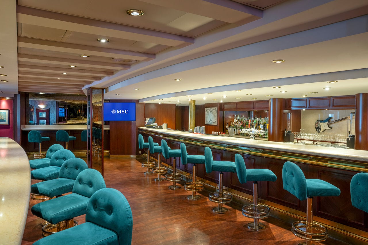 The Lord Nelson Pub on MSC Lirica offers inviting seating and a spacious bar area for guests | MSC Cruises