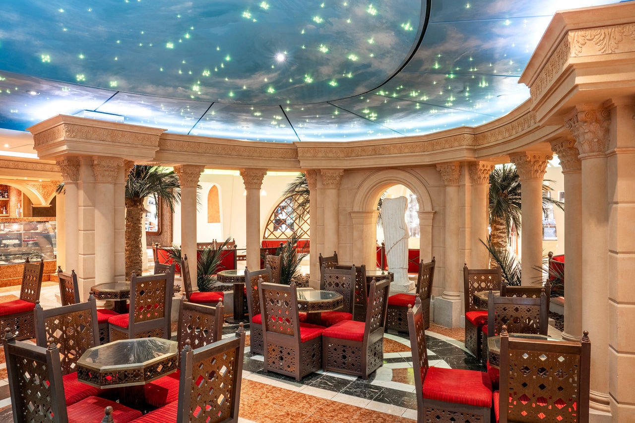 Inviting seating area with elegant tables and chairs on board the cruise ship | MSC Cruises