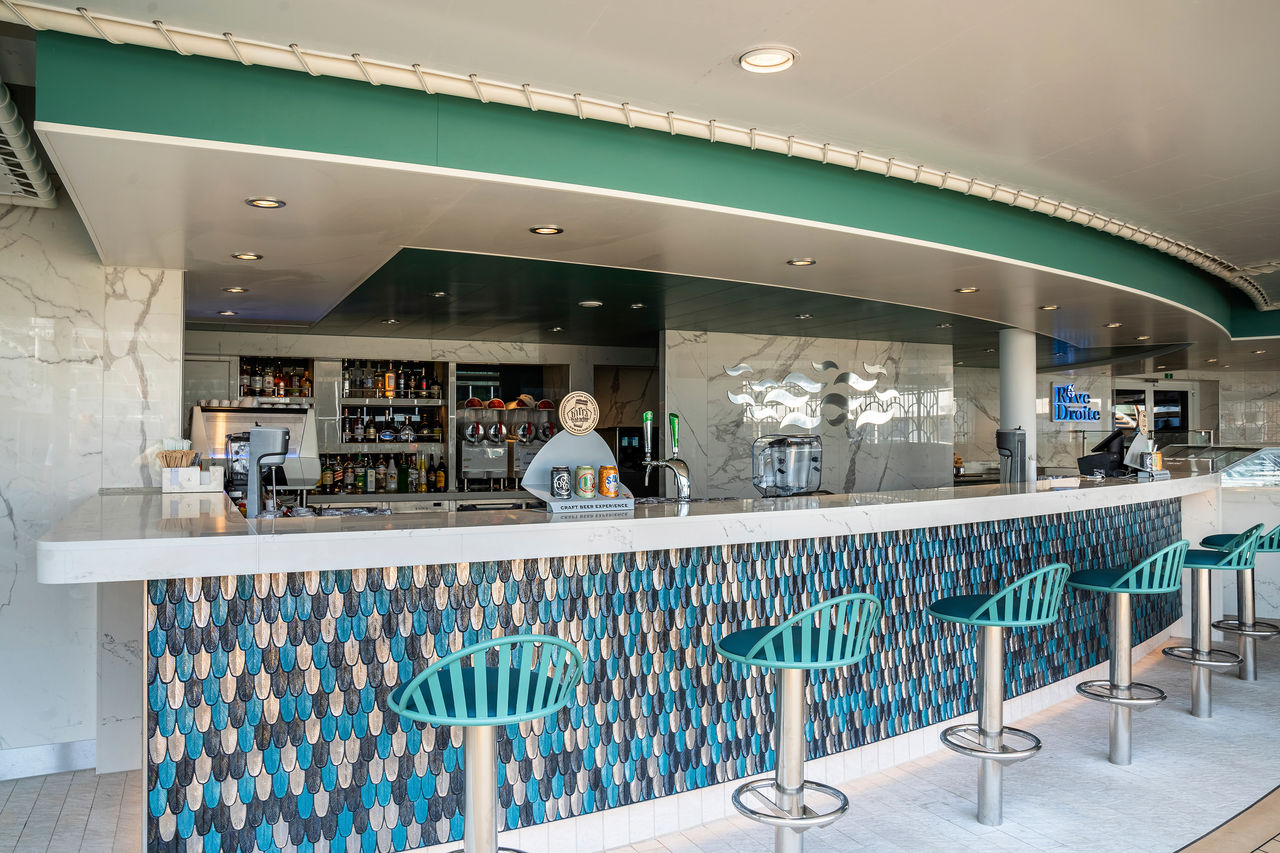 Rive Droite bar with inviting counter seating on MSC World Europa | MSC Cruises
