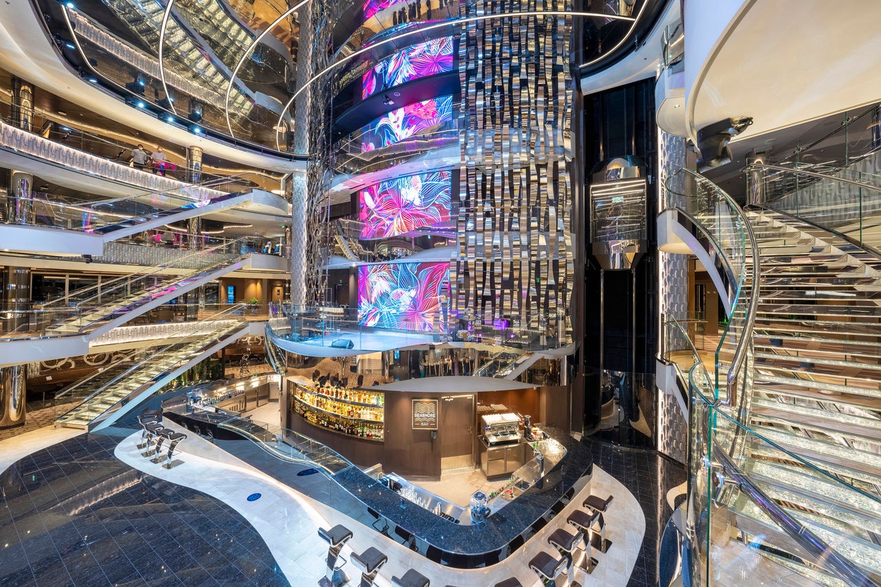 MSC Seashore atrium featuring Seashore Bar, crystal stairs and vibrant lighting | MSC Cruises