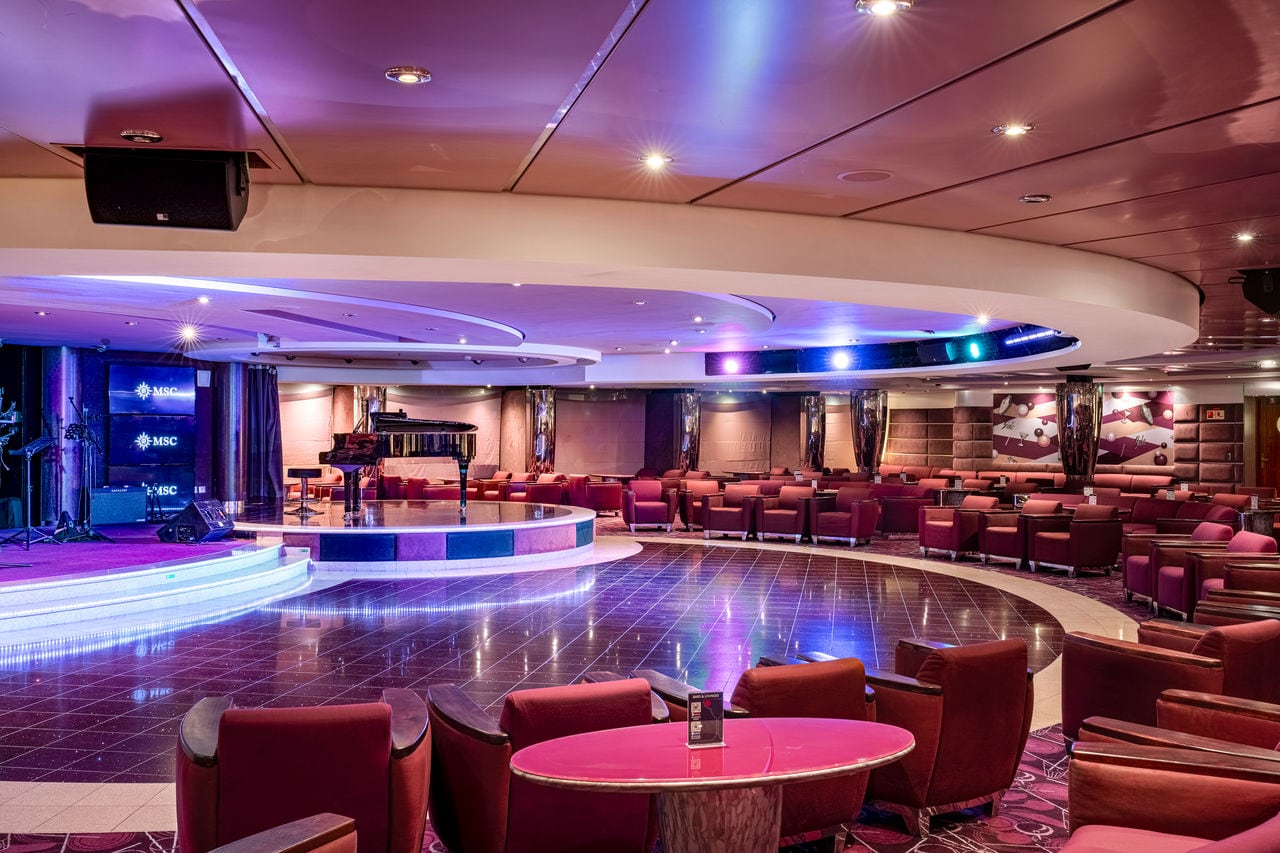 The Shaker Lounge on MSC Orchestra features comfortable seating and a stage for live music | MSC Cruises
