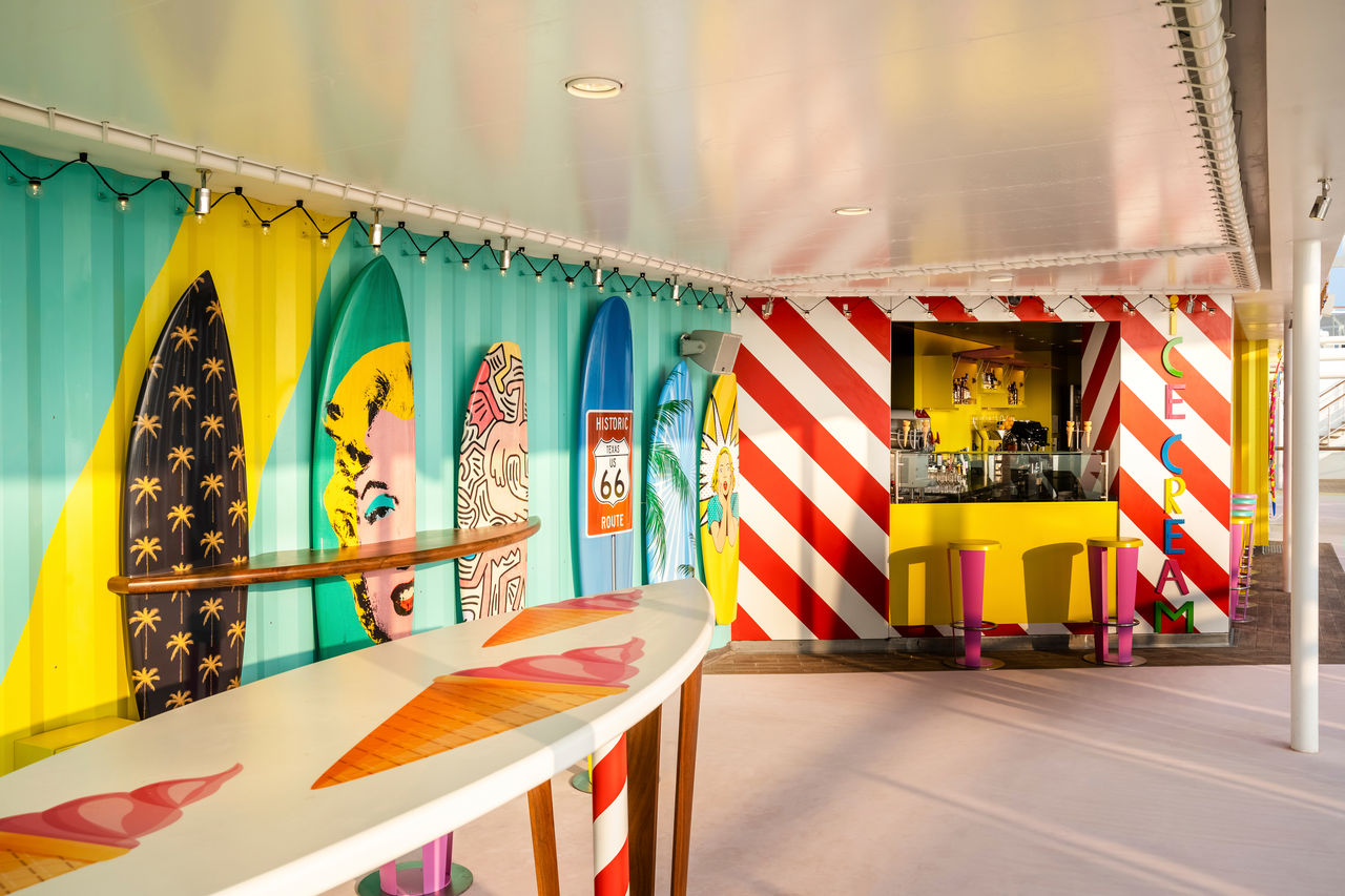 Surfer’s Bar with vibrant murals and a welcoming lounge area on MSC World Europa | MSC Cruises