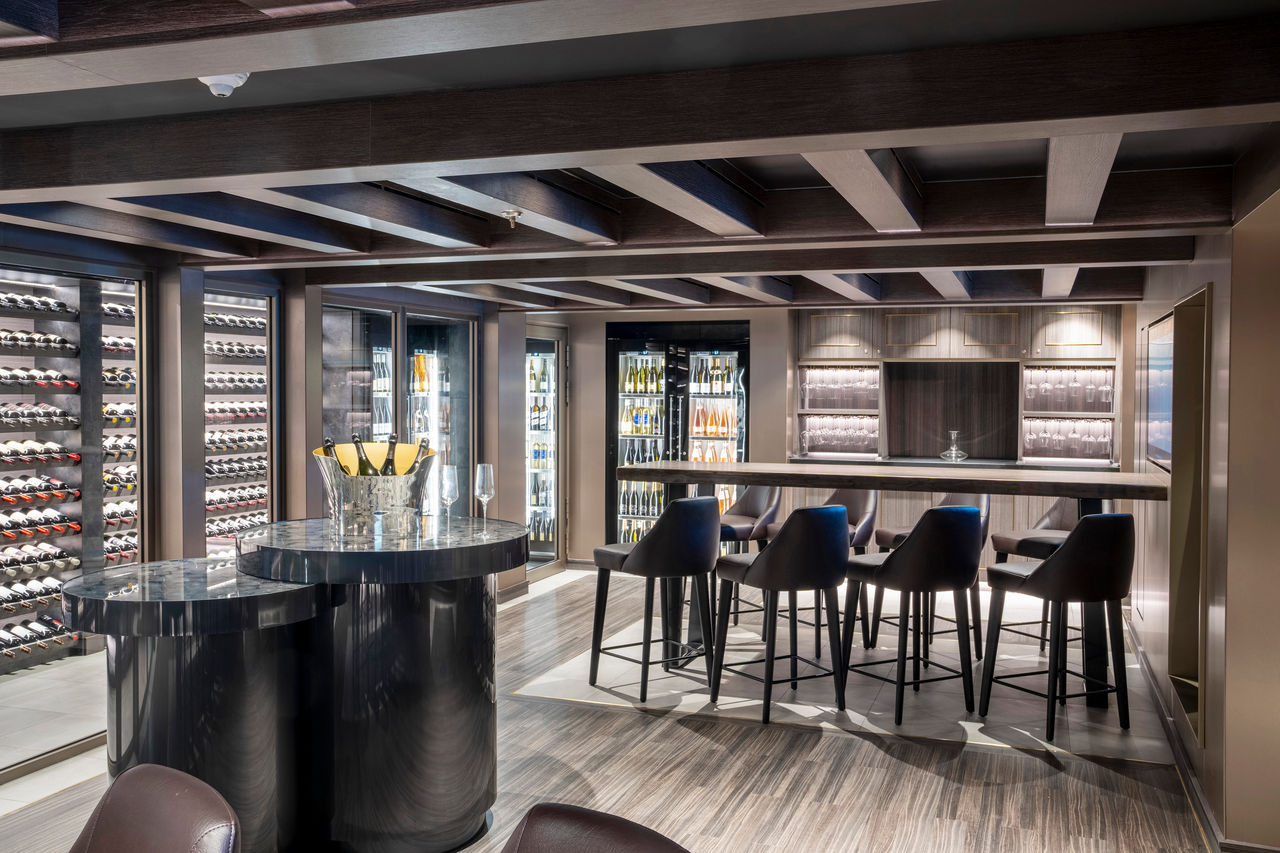 The Wine Cellar on MSC Seashore with bottles, glasses and inviting tasting spaces | MSC Cruises
