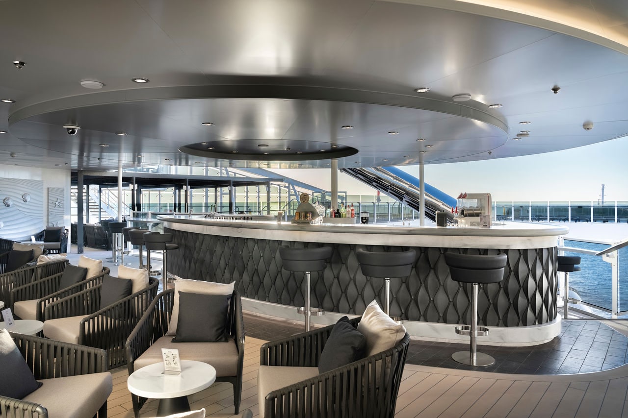 Zen Bar and sitting area aboard MSC World Europa overlooking the sea | MSC Cruises