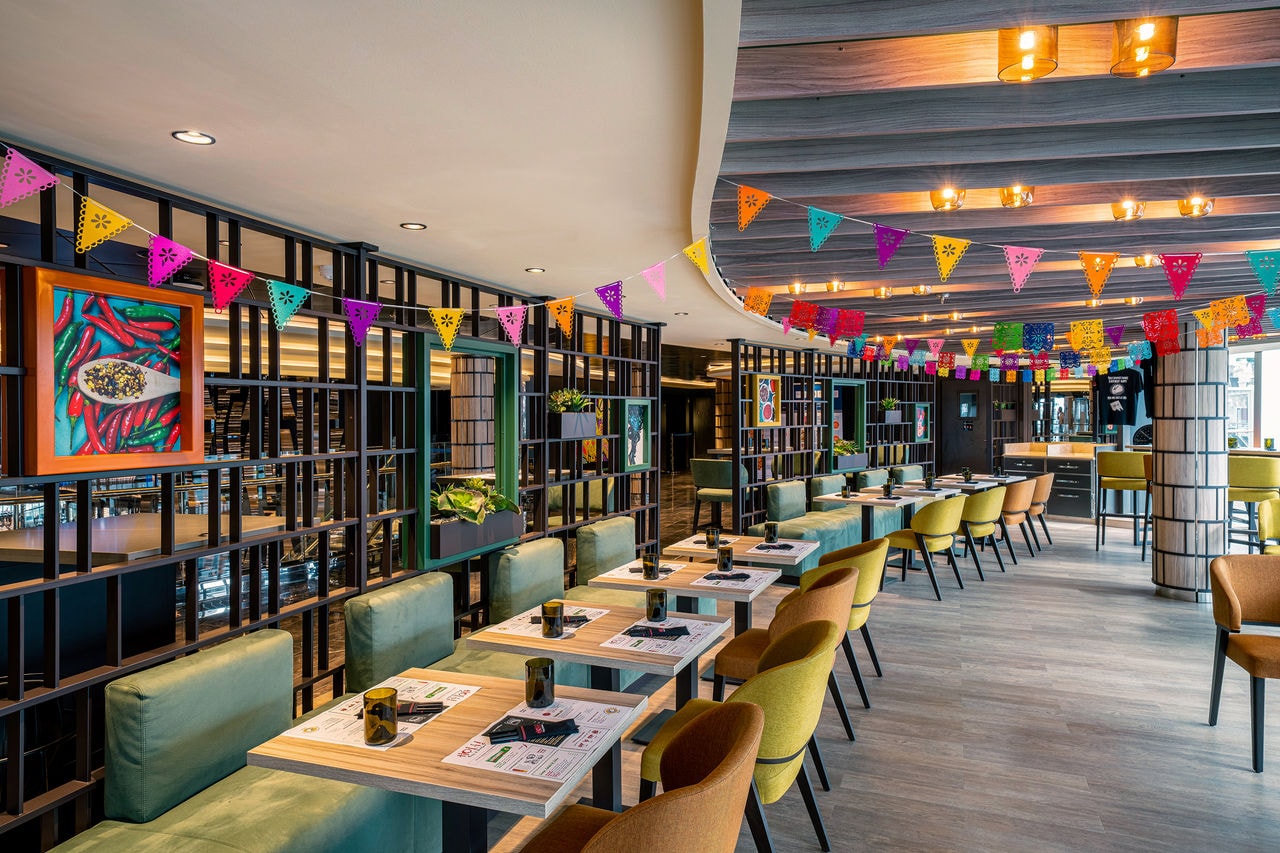 Colourful and welcoming seating area in a specialty restaurant aboard a cruise ship | MSC Cruises