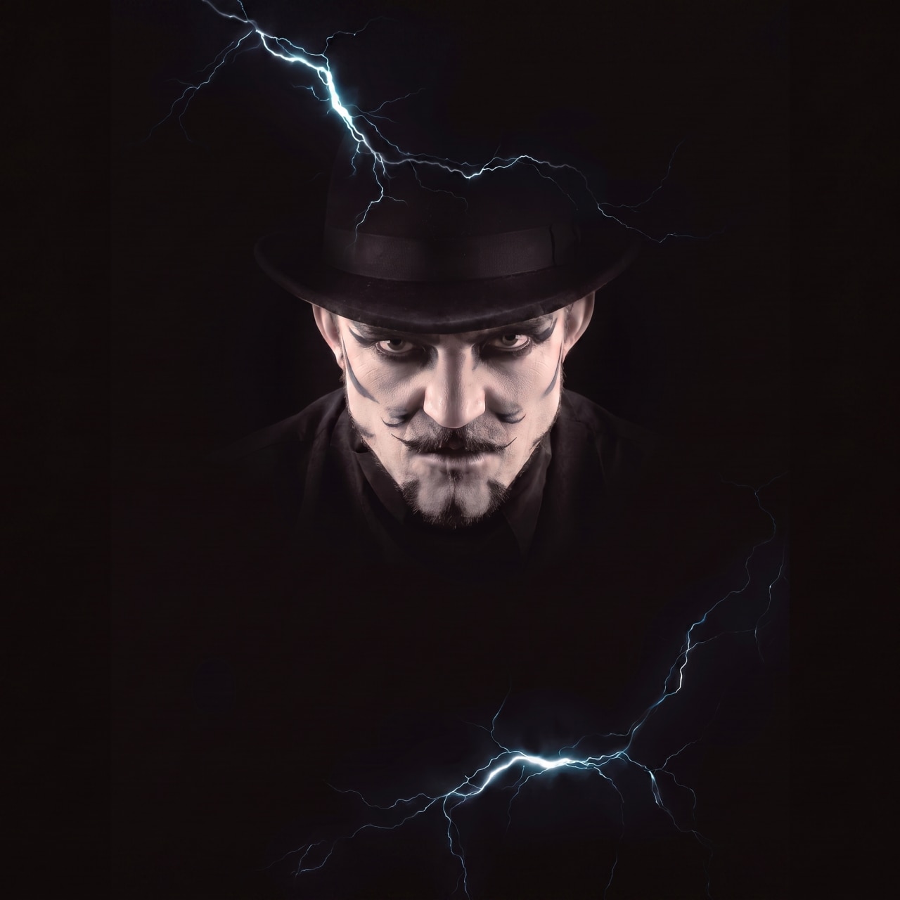 A theatrical stage with dramatic lighting and a mysterious character | MSC Cruises