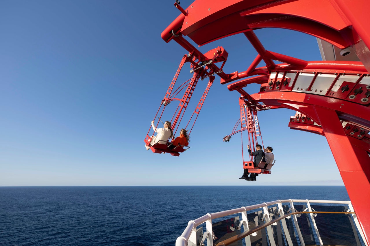 A thrilling view of the Cliffhanger ride on MSC World America with the vast sea in the background | MSC Cruises