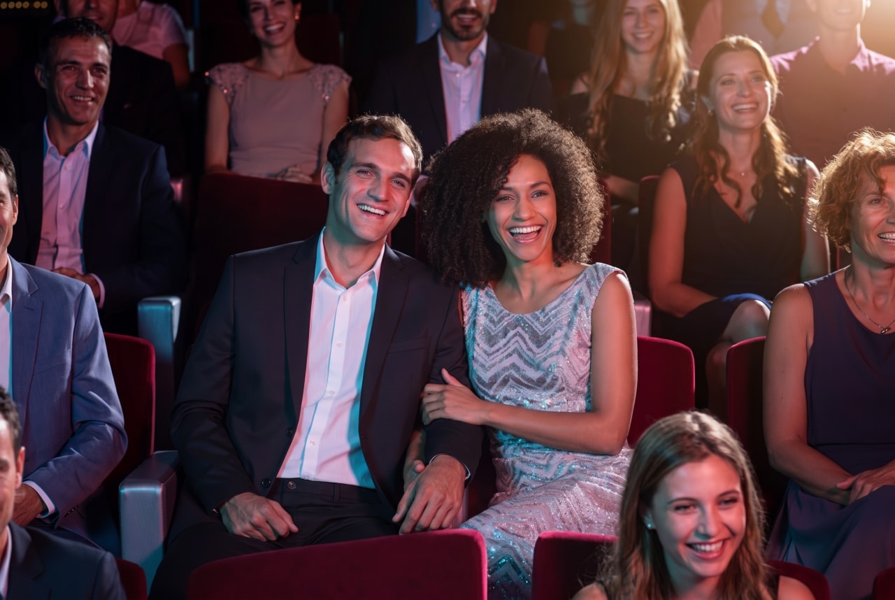 Guests enjoy entertainment in a cruise ship theater surrounded by a lively ambiance | MSC Cruises