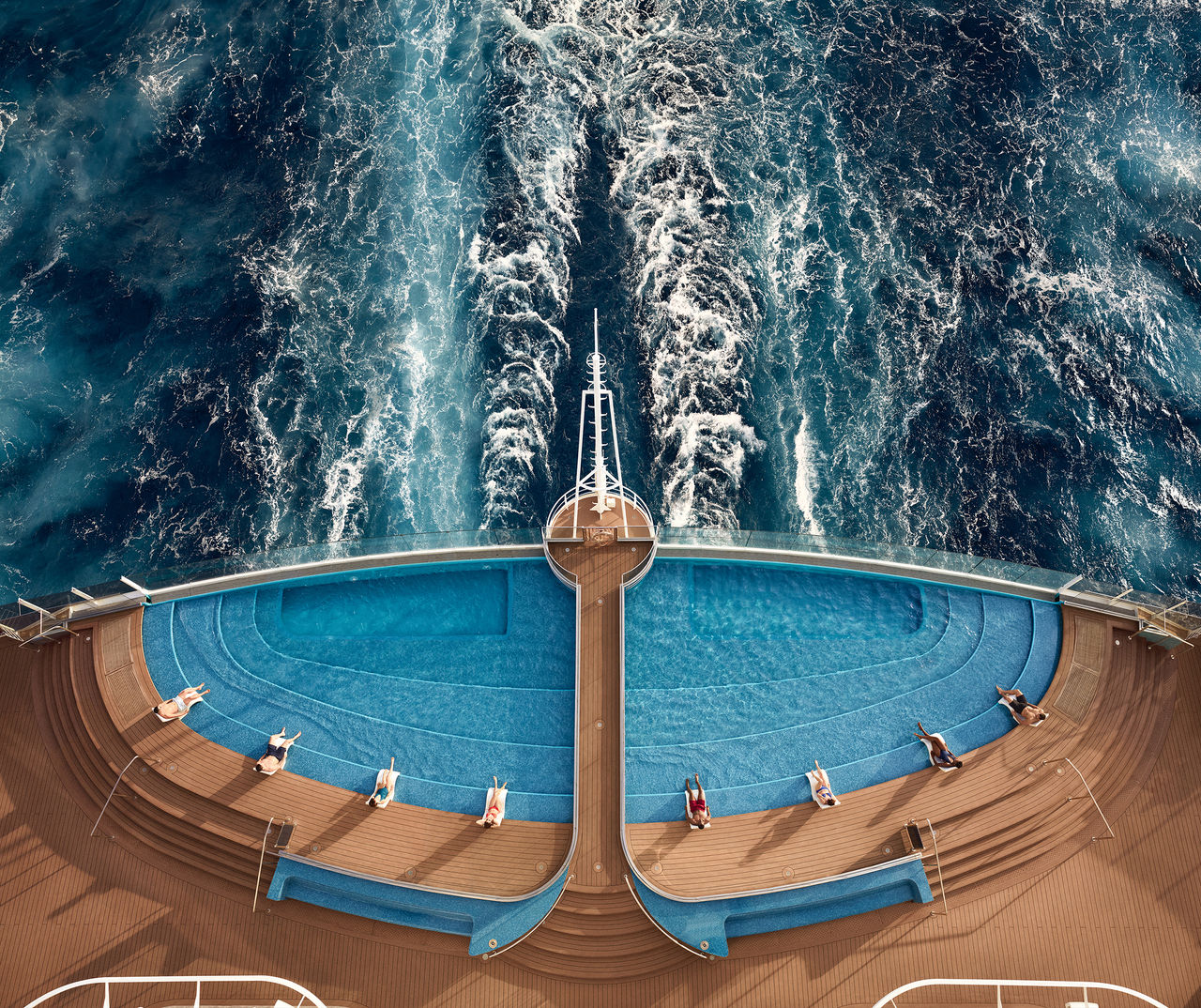 Aerial view of the Infinity Pool on MSC Seashore with foam and guests along the deck | MSC Cruises