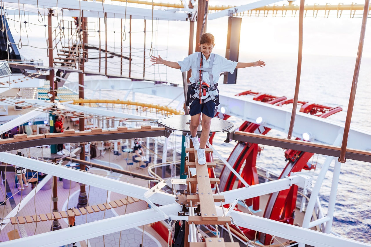 Child walks across ropes bridge on MSC World America enjoying adventure and entertainment | MSC Cruises