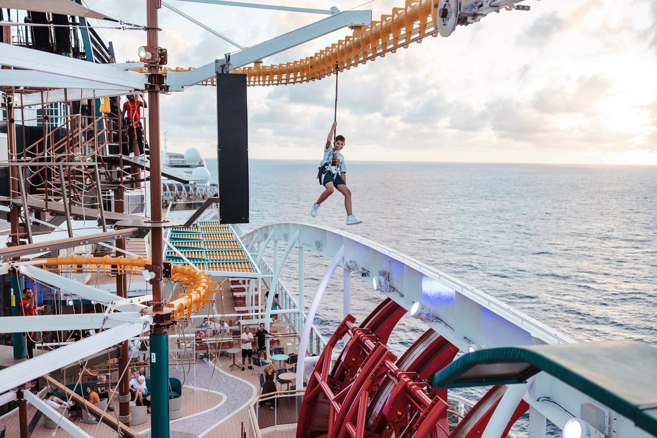 Guests enjoy a ropes course overlooking the sea on board a cruise ship | MSC Cruises