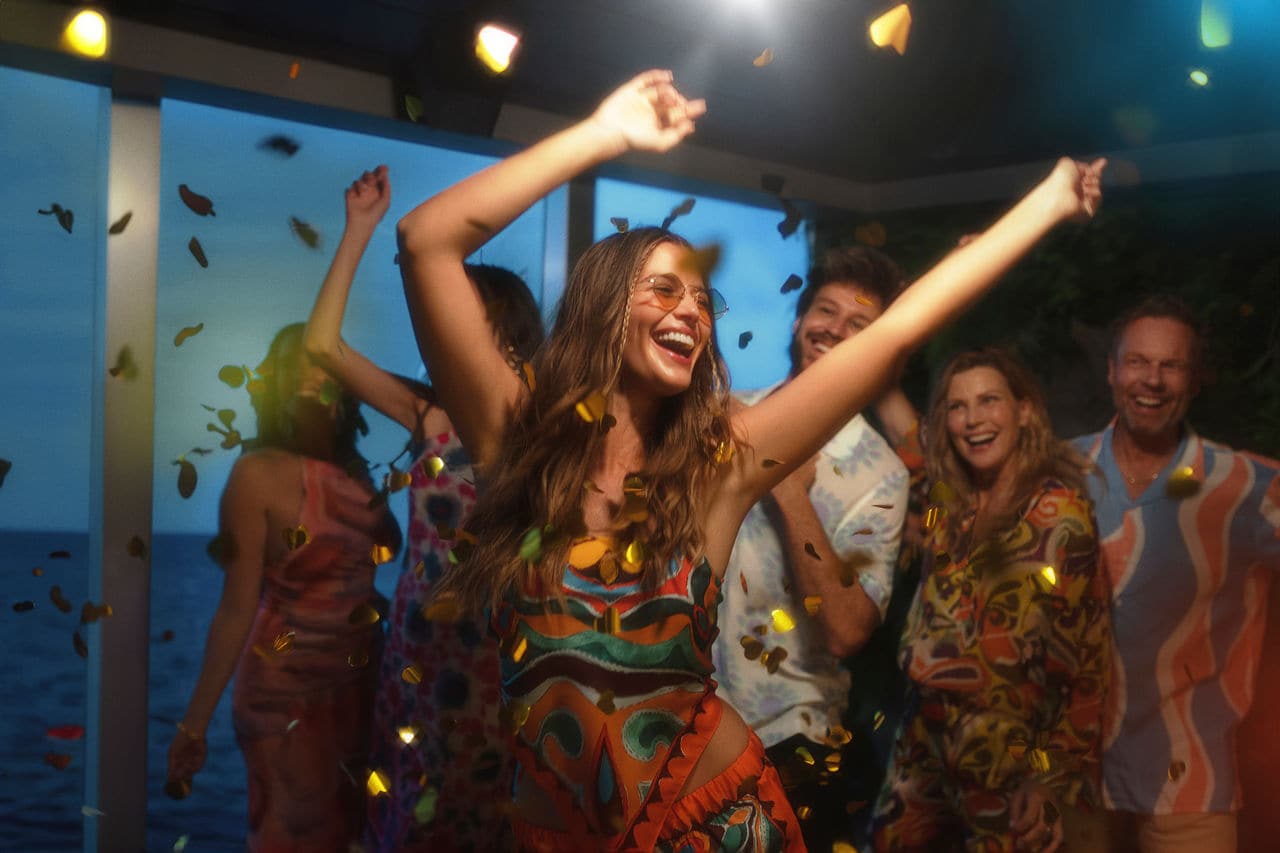 A group of friends celebrates and dances at a themed party onboard MSC Seashore | MSC Cruises