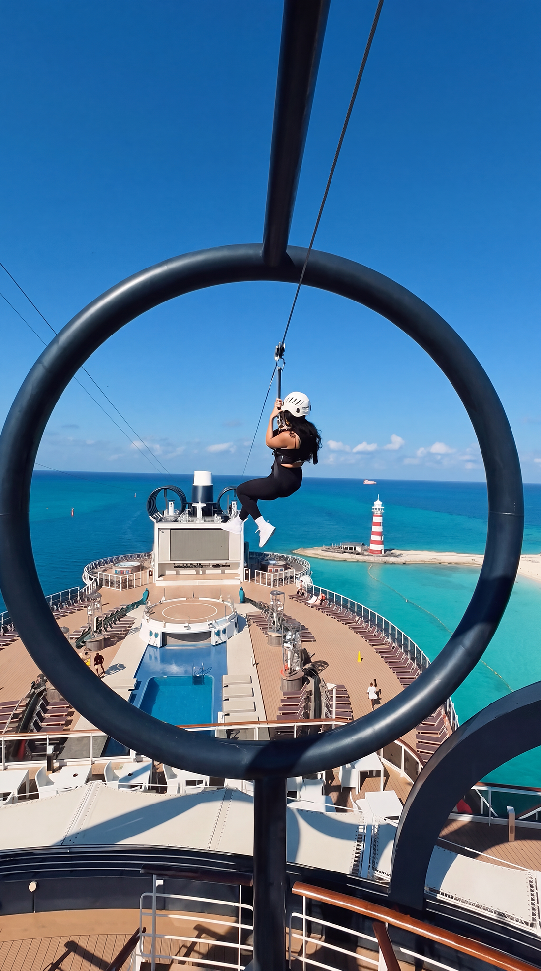 A guest experiences the zip line above the deck with a stunning view of the sea | MSC Cruises